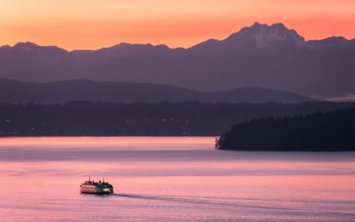 A Boat near a Shore with View of Mountains at Sunset screenshot 1