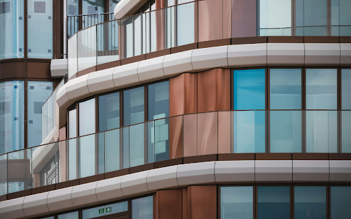 A building with glass windows and balconies screenshot 1