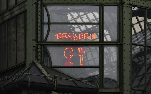 A neon sign in front of a building screenshot 1