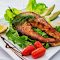 A Plated Perfection: Grilled Salmon with Fresh Accents logo