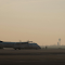 Aircraft on Runway at Sunrise in Schwechat logo