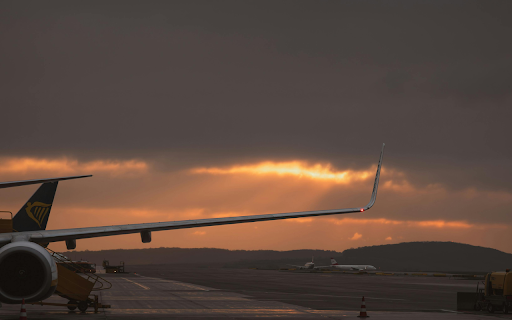 Airplane Wing Against a Dramatic Sunset in Ankara screenshot 1