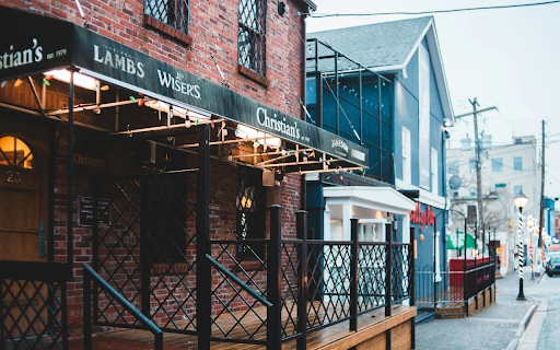 Bar building facade against walkway in town screenshot 1