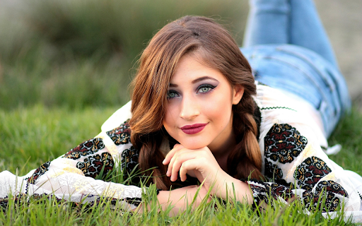 Beautiful girl lying on the grass screenshot 1