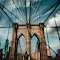 Blur Photo of Brooklyn Bridge at Daytime logo