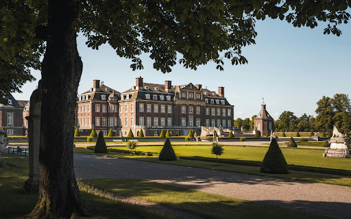 Brown Concrete Building Near Green Trees screenshot 1