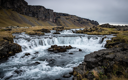 Cascading River Through Rugged Cliffs screenshot 1