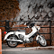 Classic White Honda Motorcycle Parked Outdoor logo