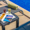 Drinks and a Snack on the Table by the Swimming Pool logo