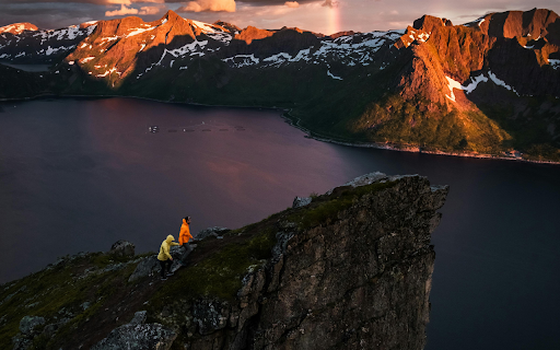 Drone Shot of People Standing on a Coastal Landform screenshot 1
