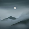 Full Moon over Foggy Mountains Covered With Clouds logo