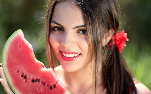 Girl holding a piece of watermelon screenshot 1
