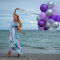 Girl with purple balloons logo