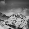 Grayscale Photo of Snow Capped Mountain logo