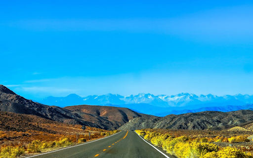 Long straight road with vast mountains screenshot 1