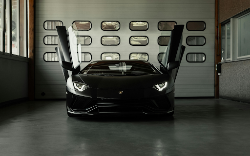Luxury Black Car with Open Doors in Garage screenshot 1
