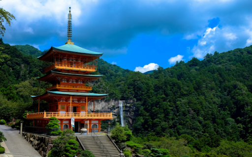 Pagoda's Radiant Ascent Amidst Emerald Hills screenshot 1