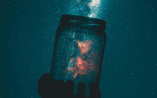 Person Holding Glass Mason Jar Under A Starry Sky screenshot 1