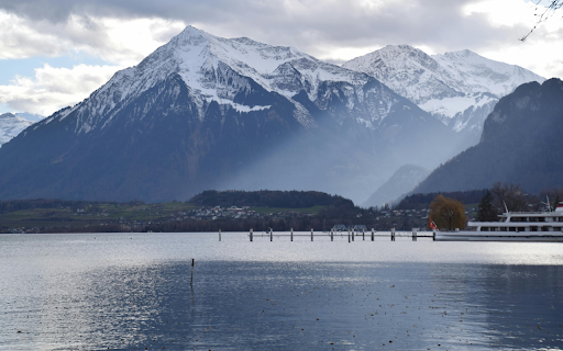 Serene Alpine Lake and Snowy Mountains Landscape screenshot 1