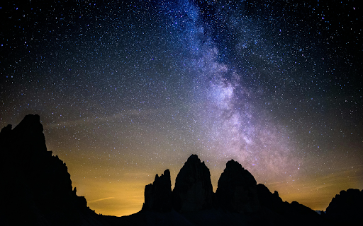 Silhouette Photography of Rocky Mountains Under Starry Sky screenshot 1