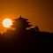Silhouetted Pagoda Sunrise logo