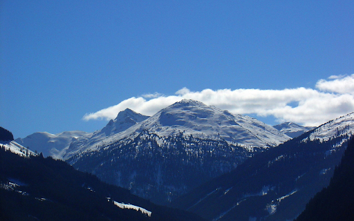 Snow-capped mountains bask in the soft screenshot 1