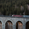 Train Crossing Semmering Viaduct in Austria logo