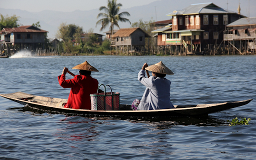 Two people rowing a boat by the river screenshot 1