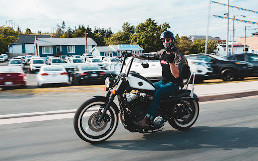Unrecognizable biker on chopper motorcycle screenshot 1