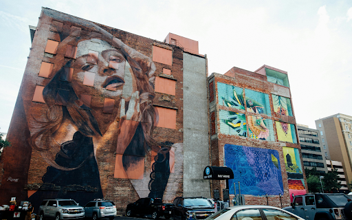 Vehicles Park Near Wall With Woman Graffiti screenshot 1