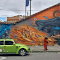 Vibrant Urban Street Art with Vintage Car logo