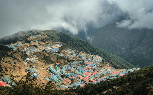 Village in the middle of green hills screenshot 1