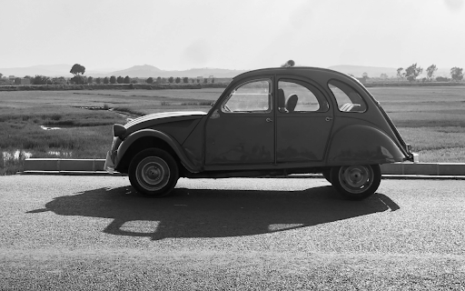 Vintage Car Parked on Roadside screenshot 1