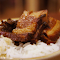 White rice and braised meat logo